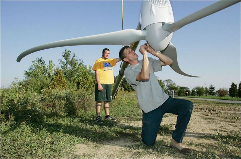 Clay High School student Rick Hmelewsky stands by as Charlie Snyder 