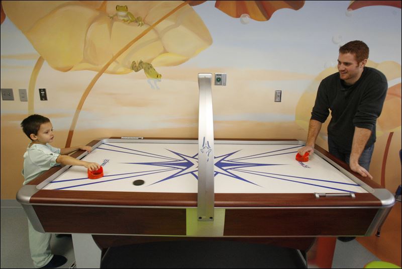 A-friendly-game-of-air-hockey-with-a-rea