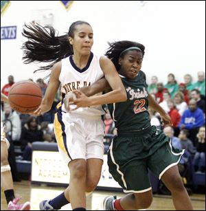 Notre Dame's Jayda Worthy (22) knocks the ball loose from Central Catholic's Jazmine Scott during their game as the Eagles knocked off the Irish to improve to 6-0 in the Three Rivers Athletic Conference.