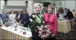 In foreground, Towne Club chairwomen Sharon Lynch, left, and Roxanne Graham at the Inverness Club.