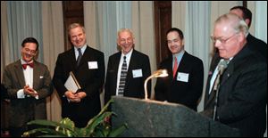 From left, John Robinson, William, Jr., William, and Allan Block enjoy Mayor Carty Finkbeiner's remarks during the program.