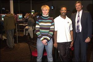 Jim Oedy, right, started the New Hope Christian Community Foundation to aid parachurch agencies such as The Mill youth center, represented by Melinda Schwerkoske, left, president of the board, and Bill Richmond, security director.