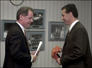 'Everyone I talked to told me this guy is a difference-maker,' said BGSU athletic director Paul Krebs, left, with Meyer.