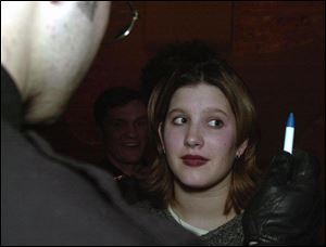 Lucas County Sheriff's Deputy Tony Hook administers a field-sobriety test to Katie Bush.