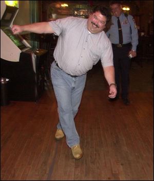 Pat McCloskey loses his balance while taking a sobriety test.