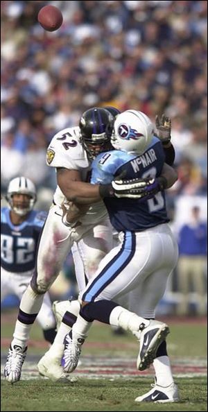 Baltimore's Ray Lewis sacks Tennessee's Steve McNair. Lewis had 187 tackles, including 120 solos, during the regular season.