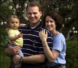 Jodie Tienvieri with her husband, Marc, and Hannah Grace, who was born just days before Mother's Day in 2000.