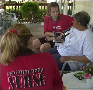 'I didn't even know I had high blood pressure until Denise came along. She made me make a doctor's appointment right then and there,' says Phyllis West, whose blood pressure is checked on her front porch by Mrs. Barnes, above.