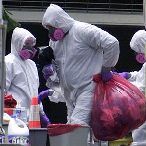 A Boca Raton Fire-Rescue Special Operations unit member works on cleanup of anthrax-tained American Media offices.