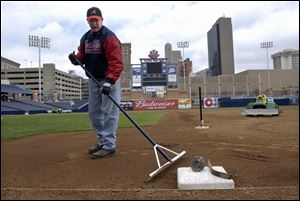 SPT April 1, 2002 - Jared Kent, assistant groundskeeper, grooms the infield at  Fifth Third Field Monday afternoon.  Players reported Monday and first practice is Tuesday.  Blade photo by Dave Zapotosky