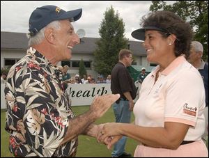 Jamie Farr and Nancy Lopez get together before yesterday's Dana Celebrity/LPGA Challenge at Highland Meadows. Lopez, who will soon end fulltime play on the LPGA Tour, was honored at last night's Owens Corning Celebrity Dinner and Show at the SeaGate Centre.