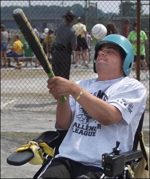 Toledoan Bryce McCoy, who is on the Maumee Dragsters team, takes a swing at the ball during Little League Challenger Division play at Rolf Field. Everyone gets five pitches before a buddy helps the batter hit the ball.