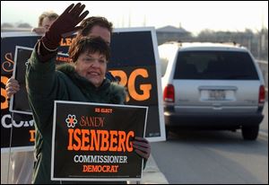 Lucas County Commissioner Sandy Isenberg makes a campaign stop outside the Jeep plant during a 14-hour day to bolster support.