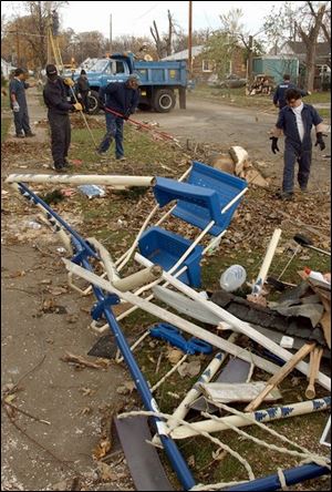 Ottawa County authorities turned to jail inmates for help in cleaning up tornado debris on Ash Street in Port Clinton.