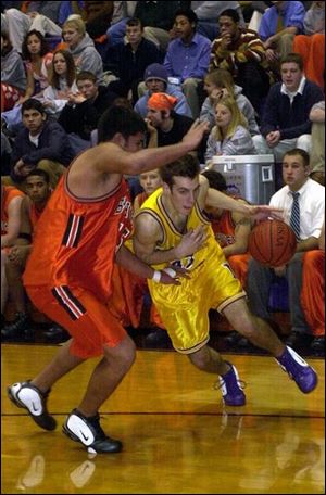 Maumee's Josh Goatley drives to the basket against Southview defender Poncho Valdez. Goatley scored eight points as Maumee improved to 4-0. Valdez had nine points for the Cougars, who fell to 2-2.