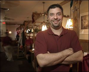 Steve Kopinski, laid off in May, became part owner of a restaurant.