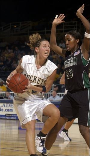 Mary Blessing, guarded by Eastern Michigan's Ryan Coleman, led the Rockets with 18 points, but she credited UT's victory to better board work. Toledo is 18-7, 11-3 in the MAC.