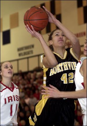 Northview's Niki McCoy scores two of her 12 points against Central Catholic last night.