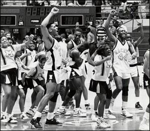 Macomber, led by Jim Jackson, left, won the title in 1989 - the first Toledo public school to do so.