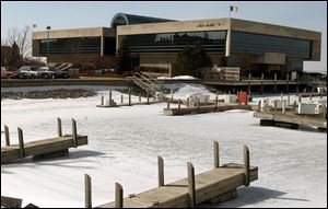 The firm's opulent glass and stone headquarters is perched along Sandusky Bay.