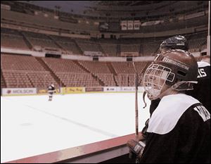 The titanic clash between teams of media members felt just like a Red Wings game - well, except for those 20,000 empty seats.