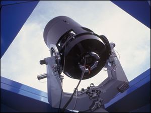 Carl W. Akerlof, a physicist at the University of Michigan, uses two optical telescopes like this one to track the afterglow of an enormous gamma-ray blast.