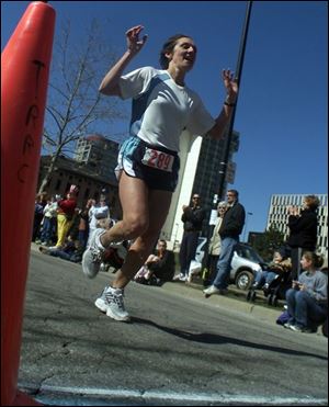 Lisa Veneziano cruised to victory in the women's division in 3:05.56.