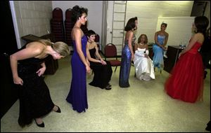 ALMOST READY: From left, Elizabeth Baucom of Cincinnati, Cami Gooding of Fostoria, Nan Miller of Columbus, Gerri Walczak of Perrysburg, Melissa Vara of Cleveland, Jennell Dunn of Northwood, and Nathanielle Mikalov of Columbus prepare for the pageant in Sylvania.