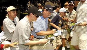 Tom Watson was busy signing autographs yesterday. He says holes 3 through 7 could produce some big numbers.