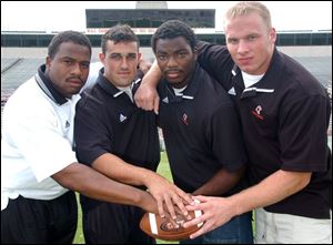 Bowling Green State University football captains are (from left) Jovon Burkes, the only junior, and seniors Mitch Hewitt, Josh Harris and Craig Jarrett. BG opens drills the first week in August. The season opens Aug. 28 vs. Eastern Kentucky.