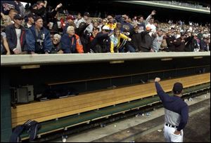 Manager Alan Trammell waves to loyal Tigers fans who showed more support than disgust during the final week.