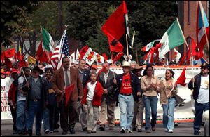 Mayor Jack Ford joins union members and supporters as they march down Maumee Street in South Toledo.