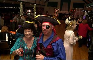 PIRATE FUN: Mary Jean Schimmel and matey Lee have an eye out for pirate fun.