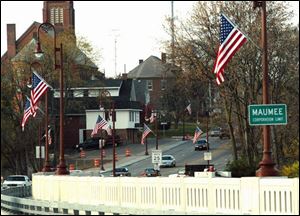 American flags line the Fort Meigs Memorial Bridge as seen from the Maumee side.