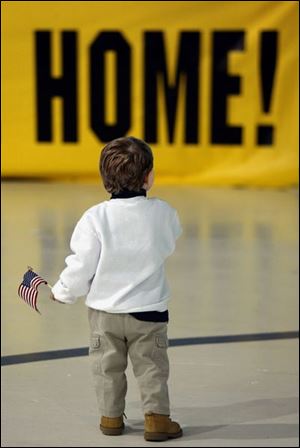 Alex Jones, 2, waits for his dad, Jeff Jones, who has been deployed for all but four months since his son was born.