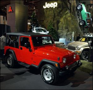 SHOW07P 3 1/6/04 PHOTO BY LORI KING Jeep Wranger Unlimited with Treo, Rubicon and Liberty in display, at NAIAS in Cobo Hall Detroit.