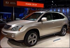 The Lexus RX 400h gets more than 30 mpg and its maker expects to sell 24,000 of the gas-battery powered vehicles.