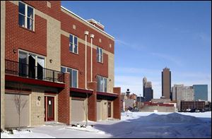 The spacious River West Townhomes on South St. Clair Street, modeled after a Chicago rowhouse project, have attached garages and, for the party-minded, rooftop decks.