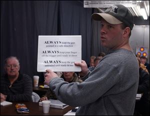 Chad Cleland teaches a concealed weapons class at Cleland's Outdoor World.