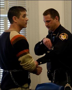 Thomas Kern is handcuffed after being sentenced to four years in prison for aggravated vehicular assault after a car crash in May 2003, seriously unjured former Wayne Mayor James David.