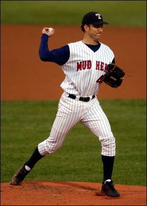 Mud Hens pitcher Pat Ahearne makes a throw to first base. He allowed only one run and six hits in seven innings.