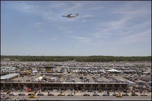 A C-141 flies over the Michigan International Speedway to start the ARCA event. The jet's noise shook the grounds, but the average race speed was 112.518, second-slowest in MIS history.