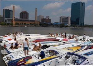 SMOKING: Dozens of cigarette boats are idle -- for now -- at the docks. The sleek cigarette boats are long and narrow for only one purpose, and that is to go fast.