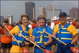 OAR ELSE: From left, Cynthia Ford, Joanne McElheney, and Debbie Mertz paddle up International Park.