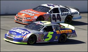 Kyle Busch (5) drives past Justin Labonte in yesterday's Cabela's 250 at Michigan International Speedway. Busch is only 97 points behind Busch Series points leader Martin Truex Jr. 