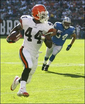 Cleveland Browns running back Lee Suggs (44) runs away from Detroit's Teddy Lehman for a touchdown.