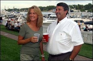 GOTTA REGATTA: Nancy and Vice Comm. Brent Schneider enjoy Maumee River Yacht Club's homecoming.