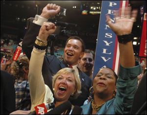 Christine Olson, left, and Renee Amore of the Pennsylvania delegation casttheir votes thatgave President Bush the GOP nomination.