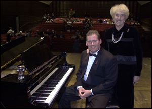 Tim Shew and his mother, Susie, at the 2001 benefit at UT.