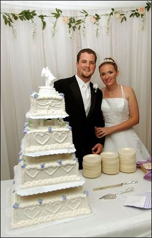 PIECE OF CAKE: Justin Ballard and Amanda Sheets find married life as delicious as Wixey cake.